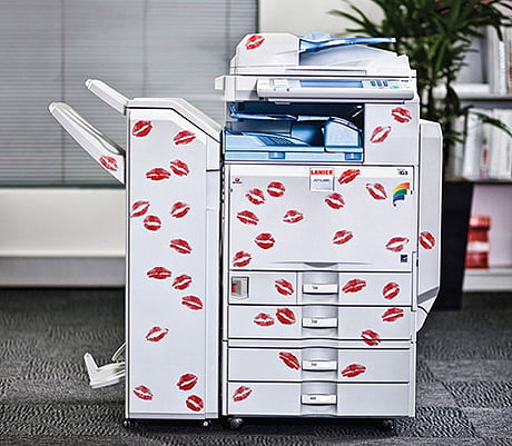Lanier ad with photocopier covered in kisses