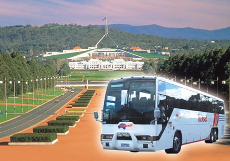 Trekset tour bus against destination landscape