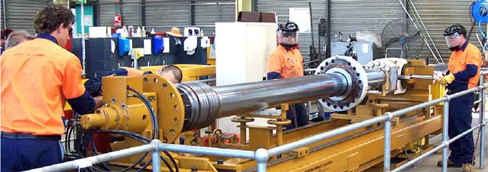 Hydraulic engineers working on Eastern Automation's workshop floor